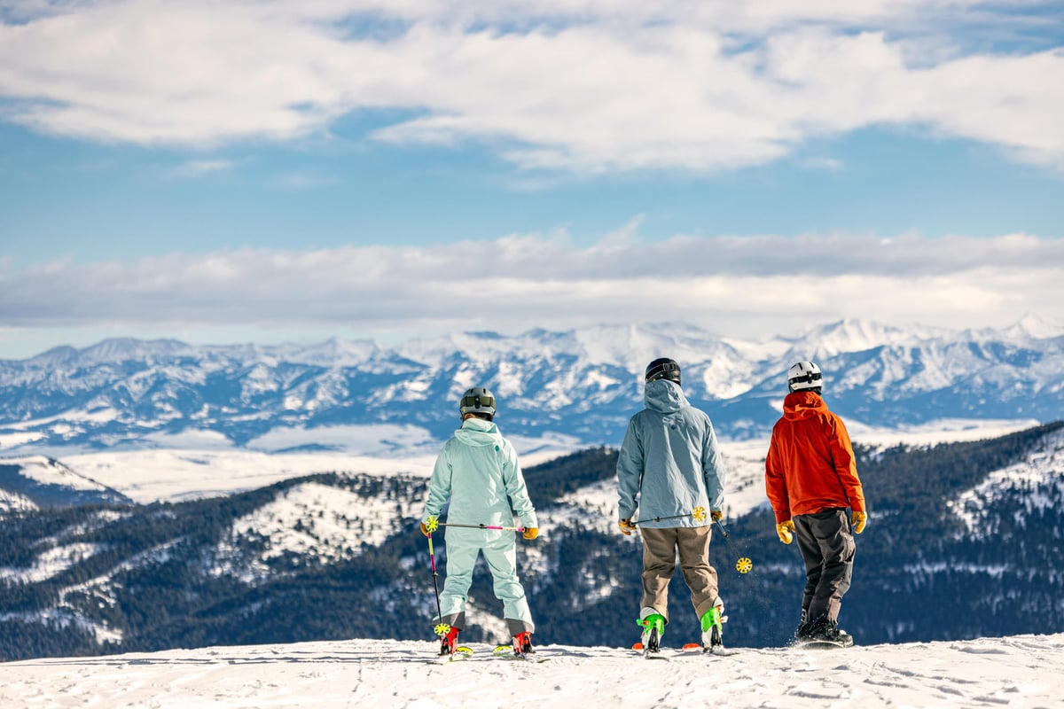 Family at the top of a ski run at Bridger Bowl.