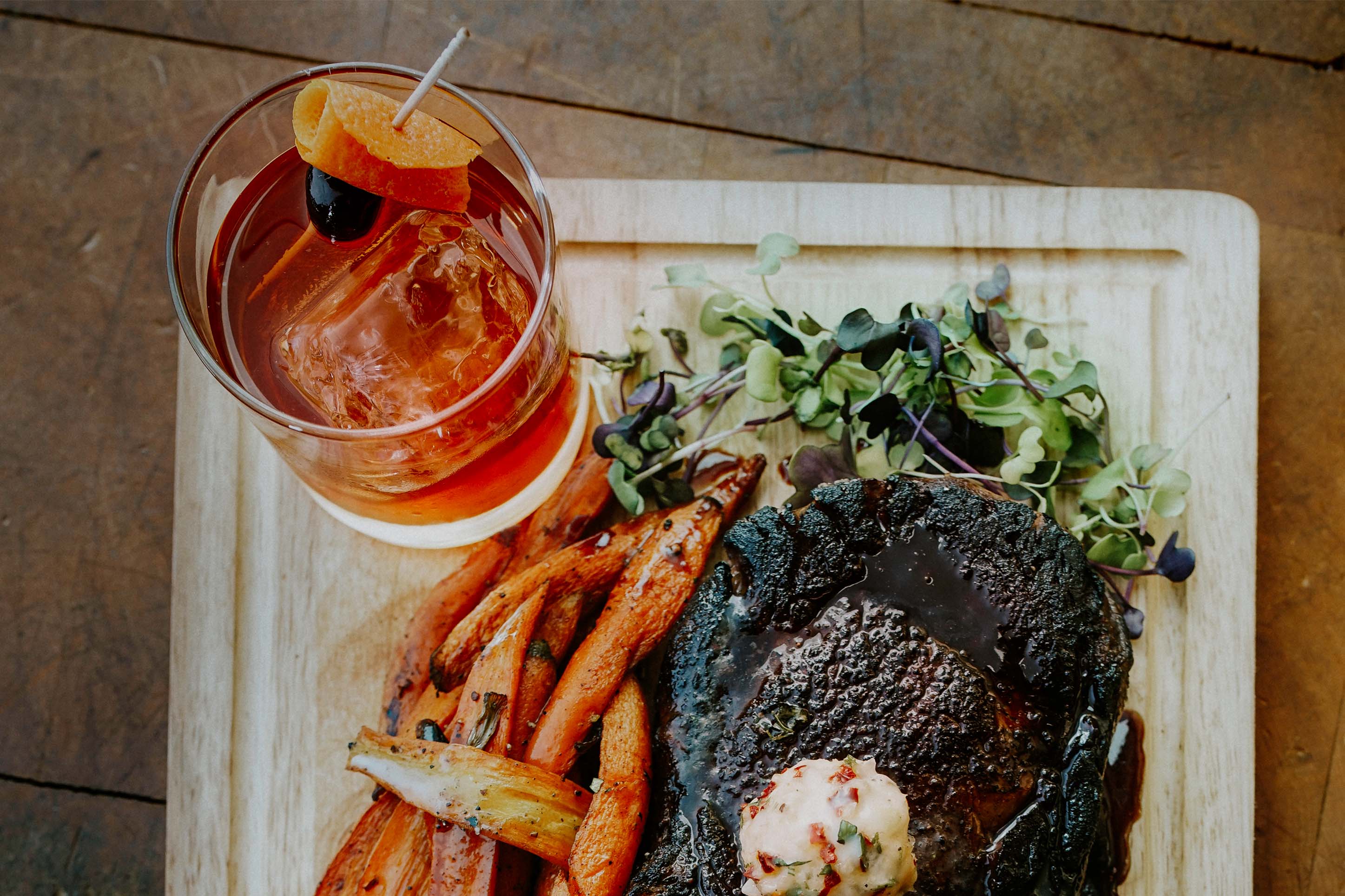 Steak dinner and cocktail from Open Range.