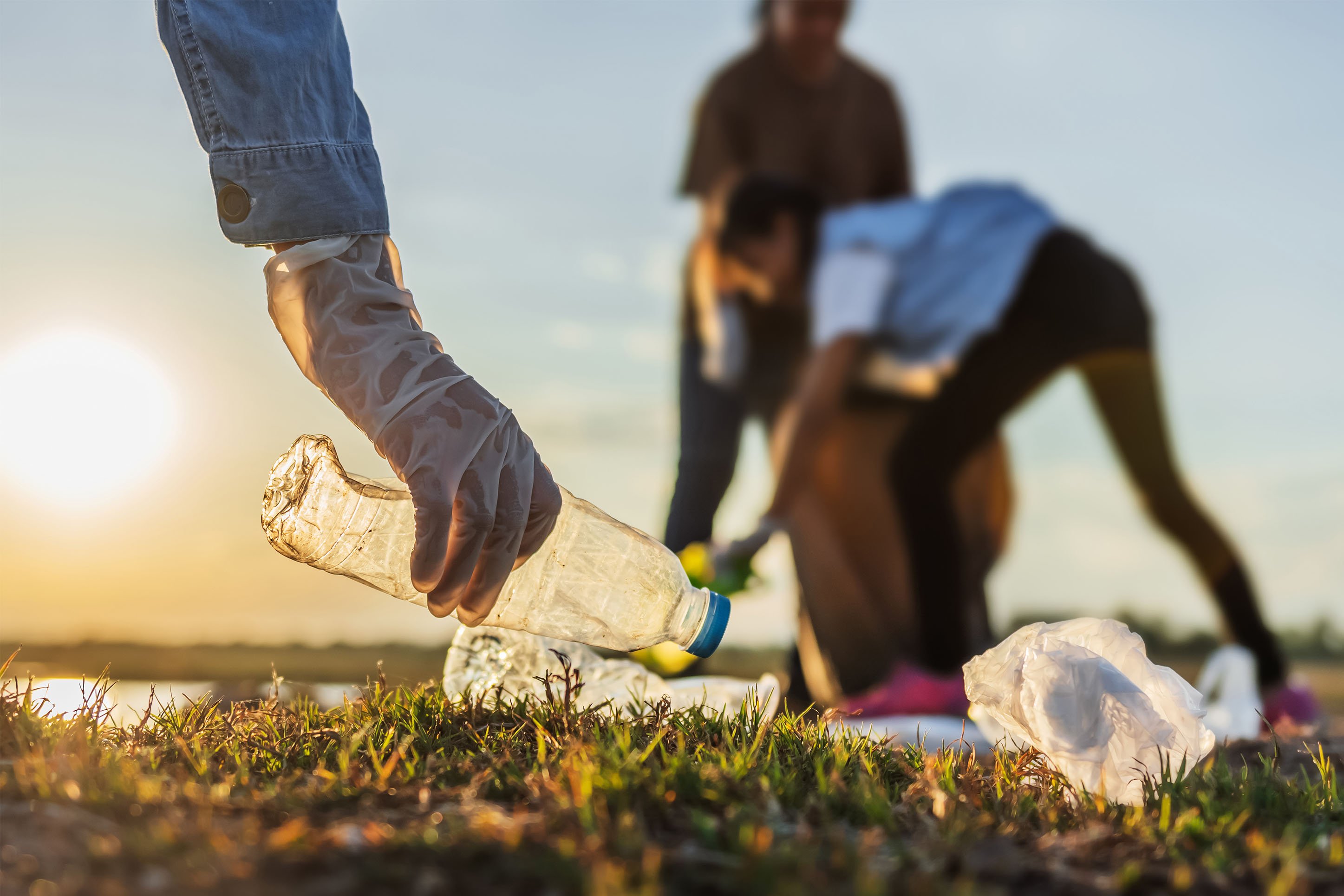 Cleaning up plastic bottles and trash. 