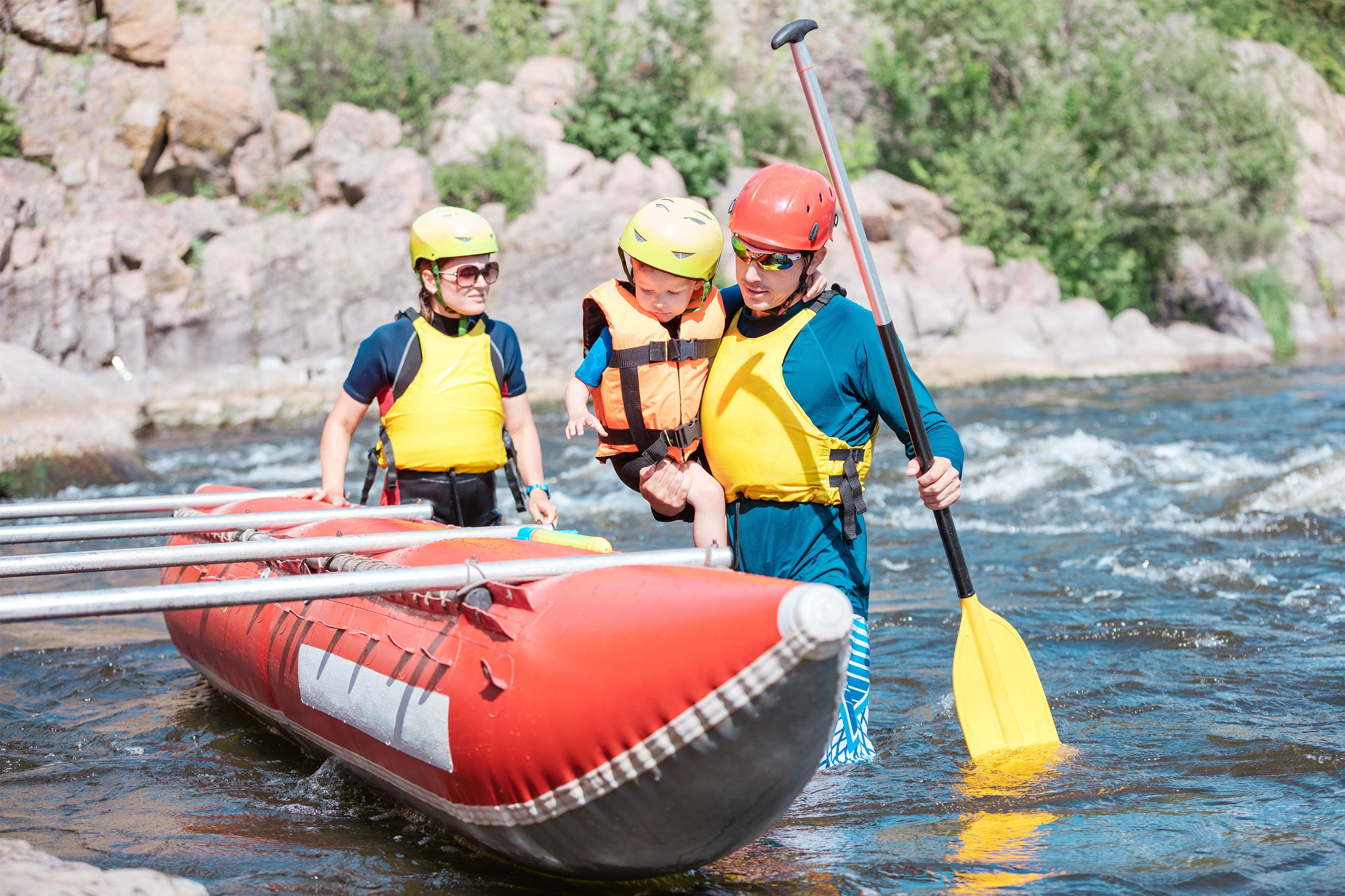 Family on a river with a guide. 