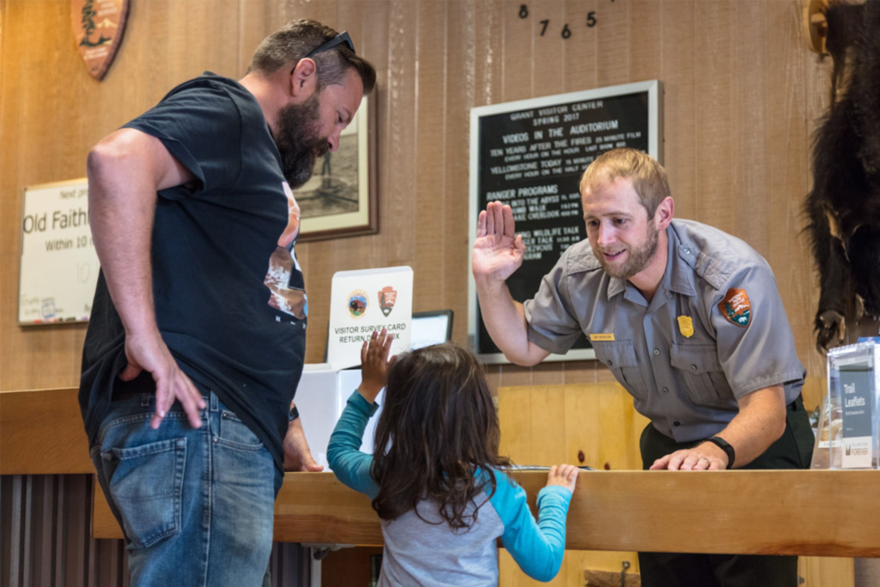 Young girl taking the Junior Ranger Pledge