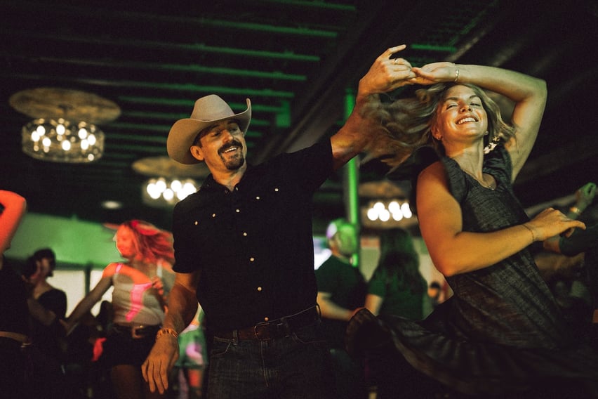 Couple country swing dancing at The Jump in Bozeman.