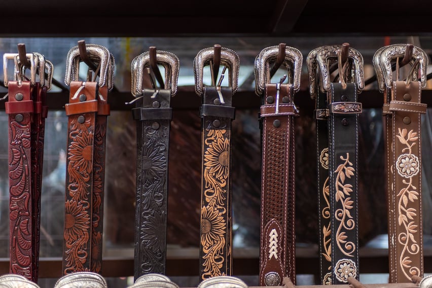 Western Belt Buckles hanging on a wall.