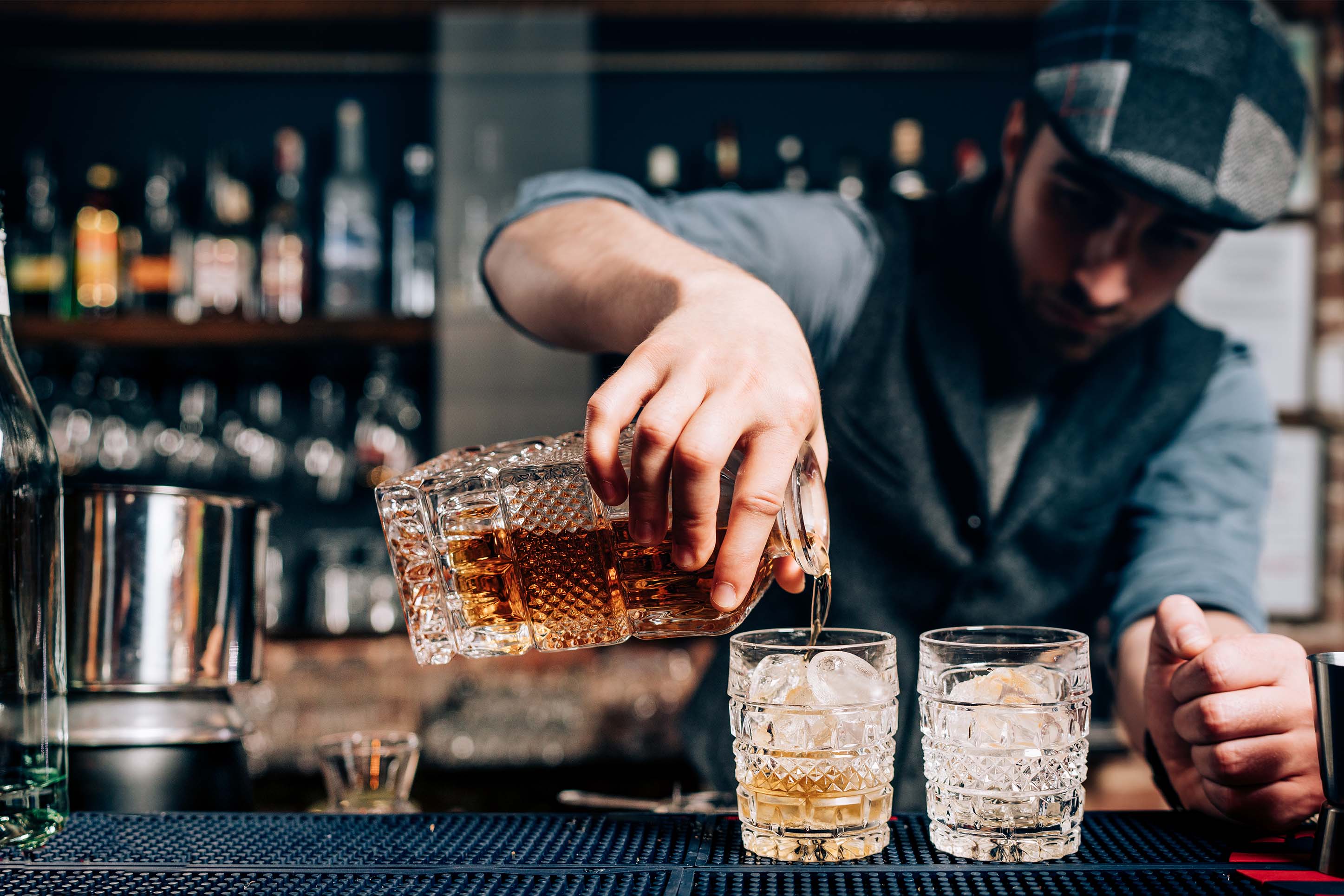 Bartender pouring cocktails at Devil's Toboggan. 