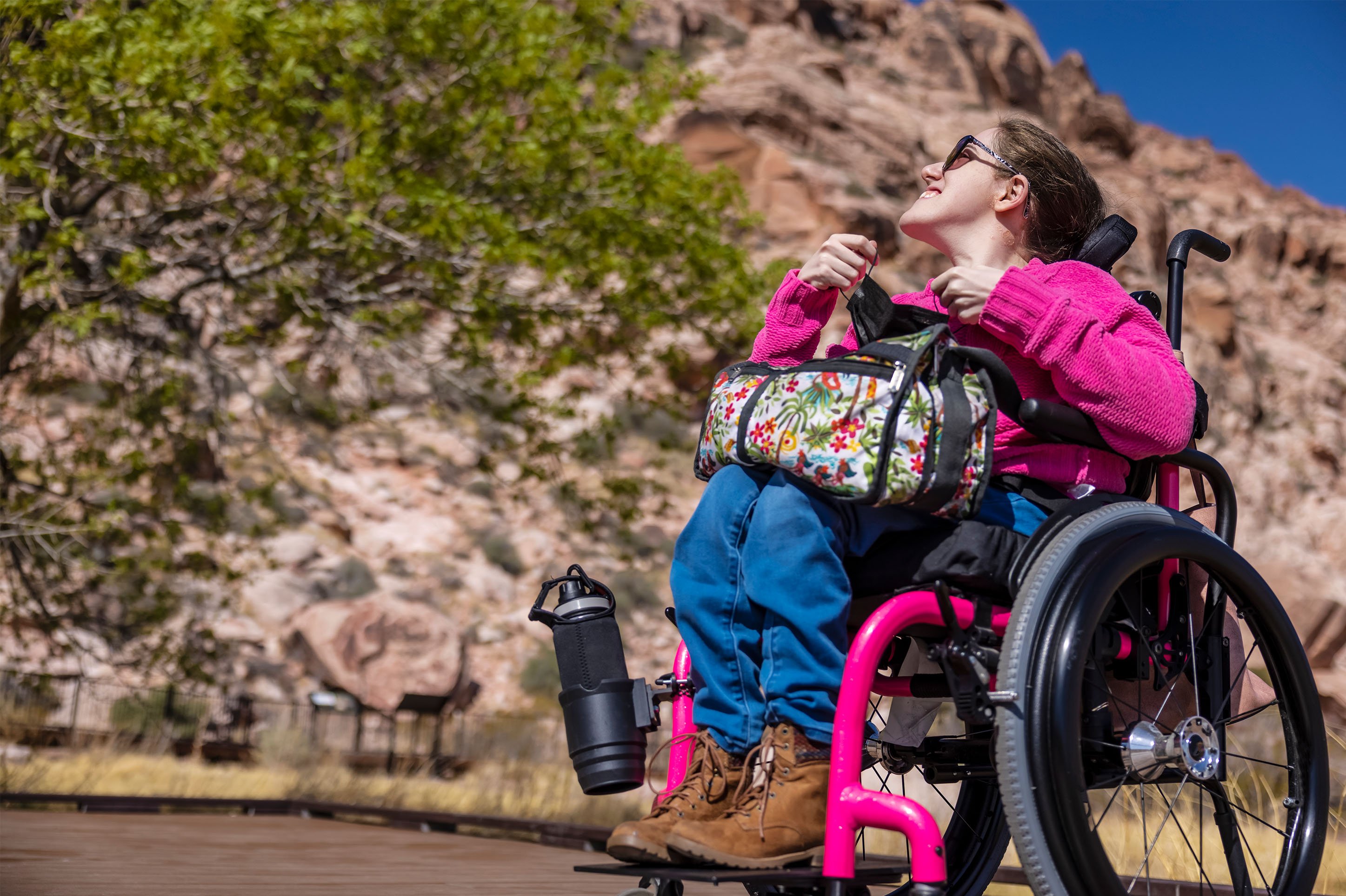 Woman taking her wheelchair on an ADA Accessible Trail