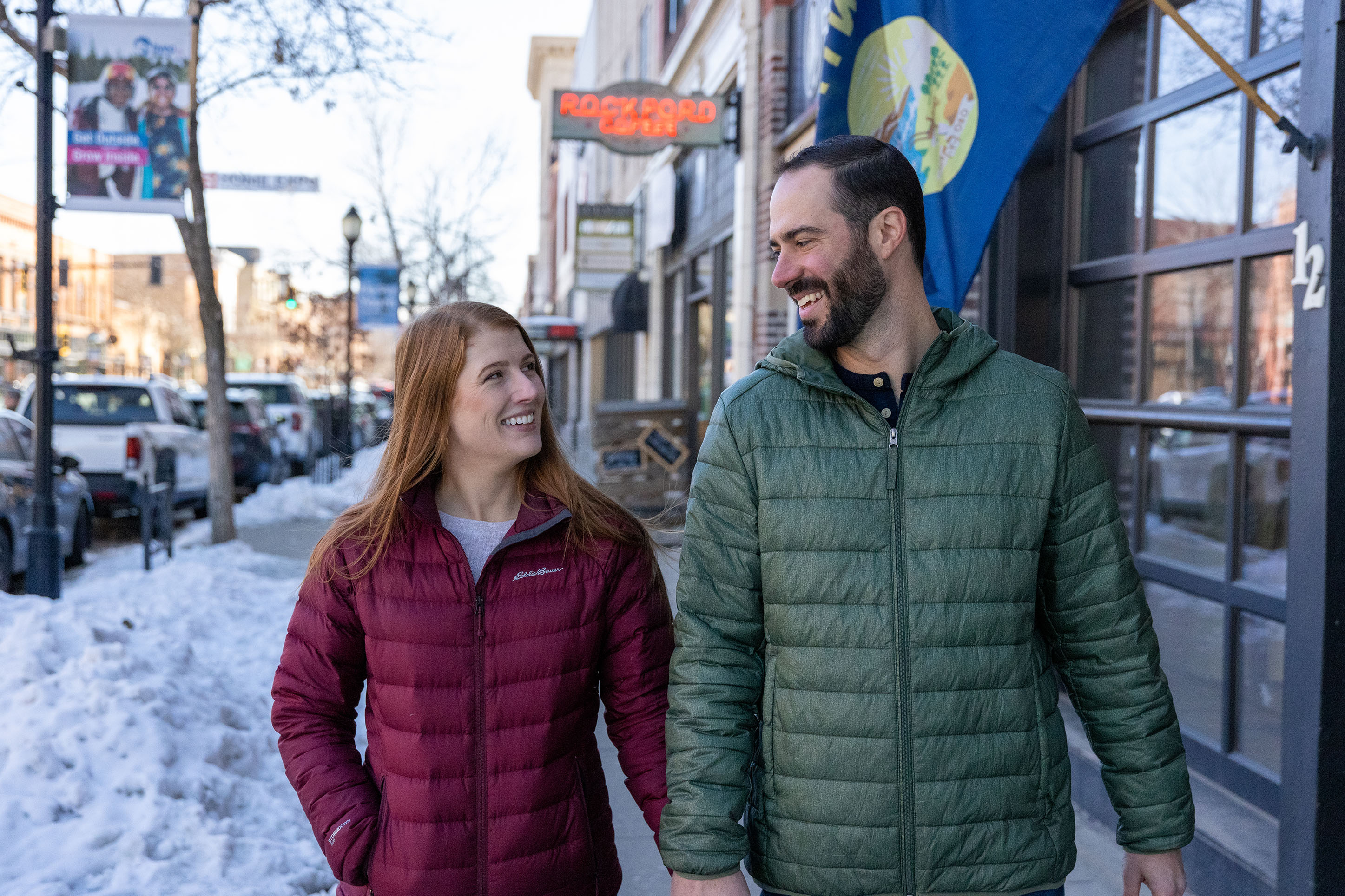 photo of a couple holding hands walking down Main Street in Bozeman