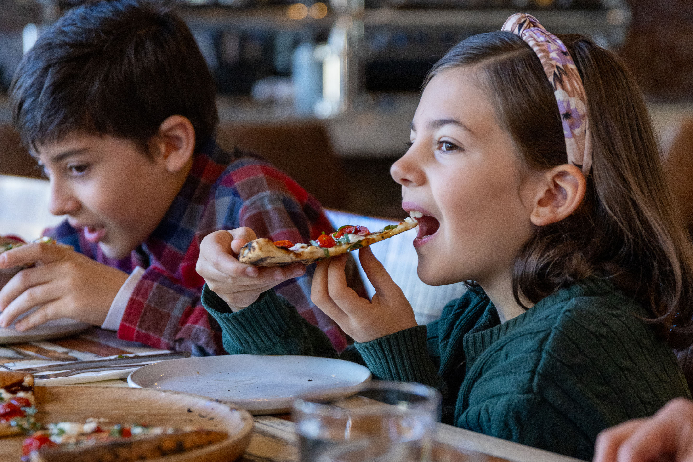 photo of children eating pizza