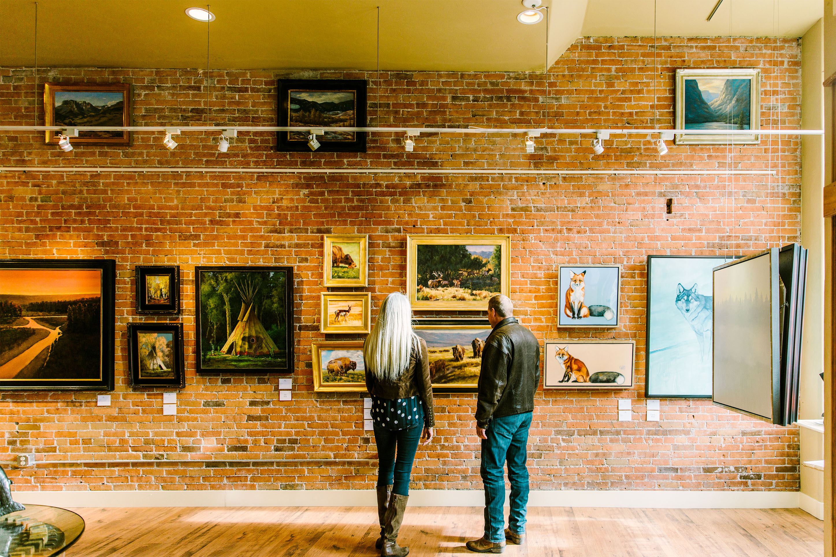 Couple admiring art in an art gallery