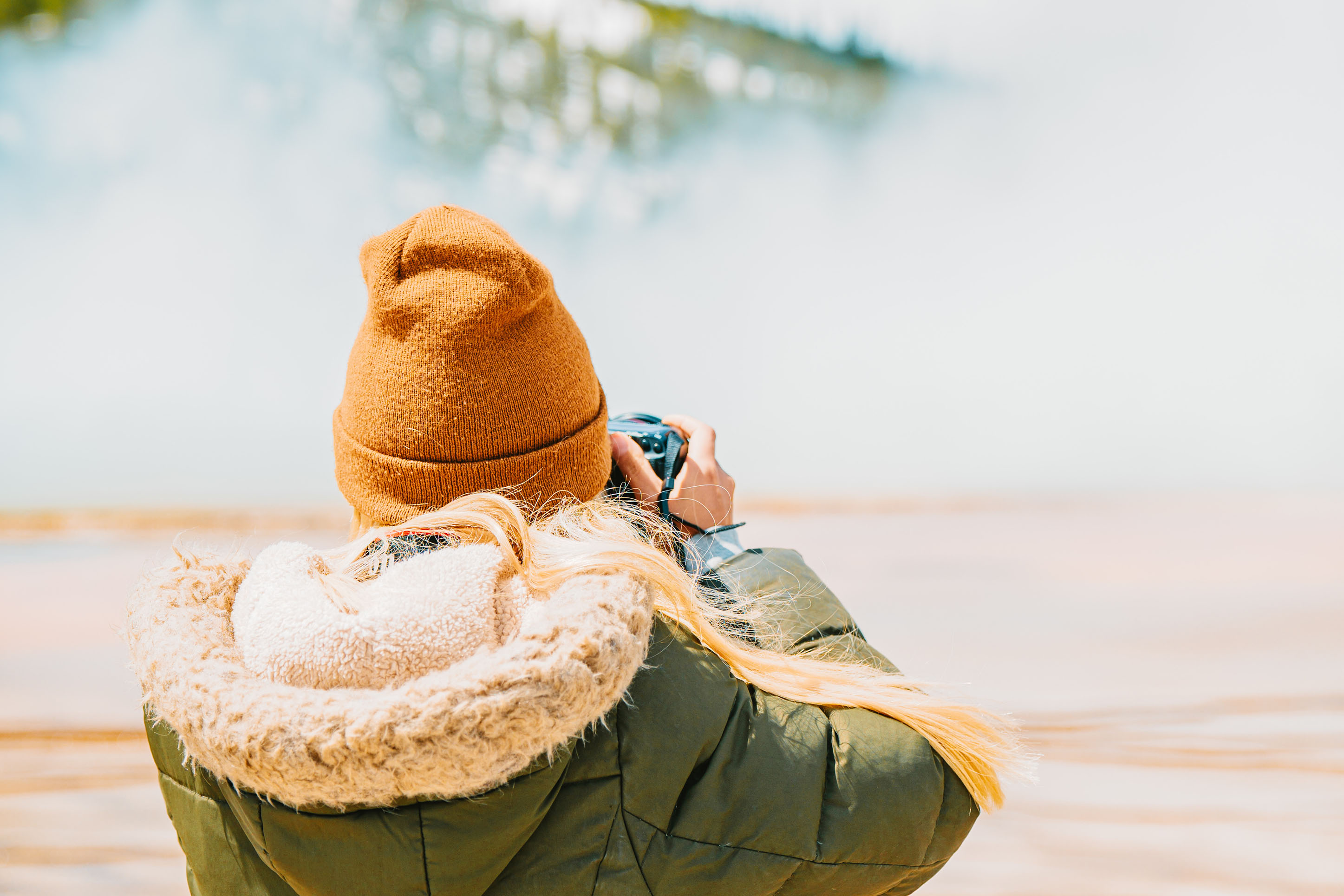 Woman taking a photo during winter. 