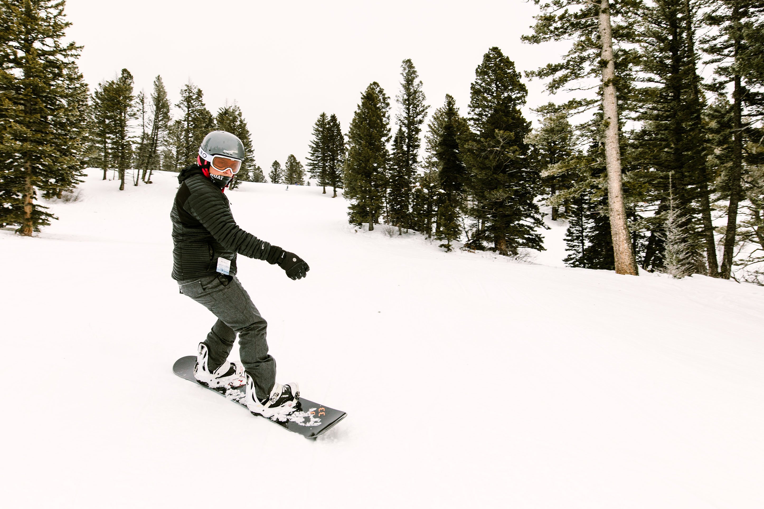 Photo of a man snowboarding at Bridger Bowl