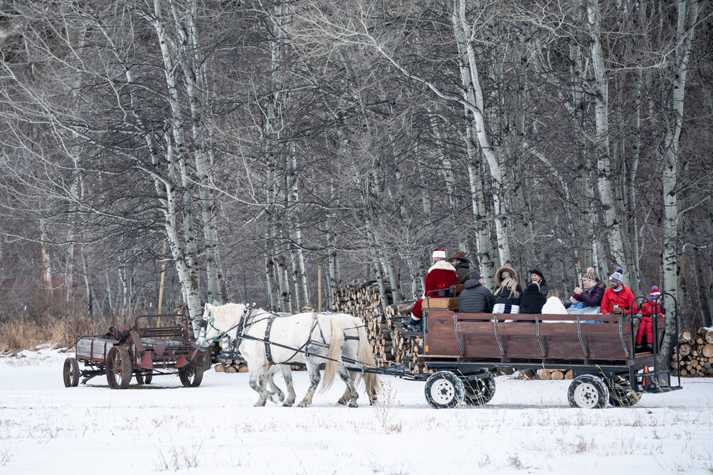 photo of a sleigh ride, pulled by horses with Santa 