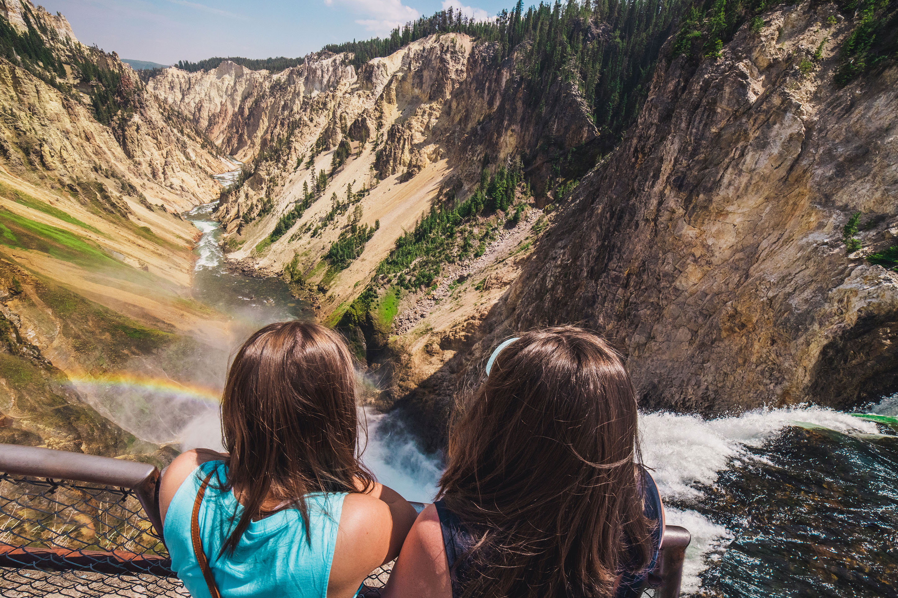 Two young girls looking at the Grand Canyon of the Yellowstone