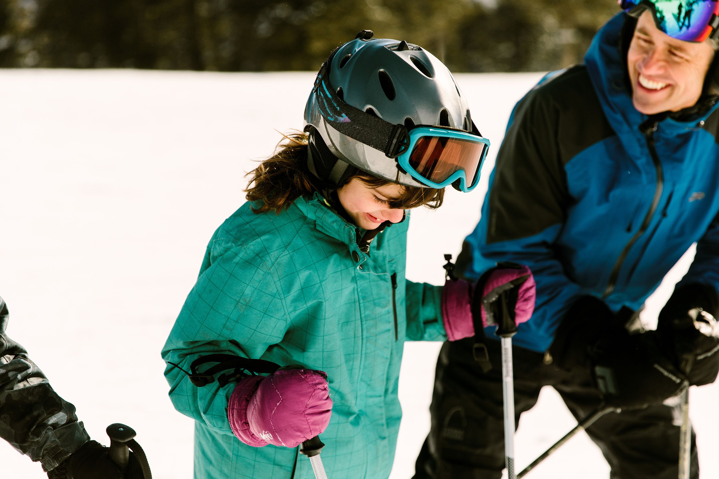 Dad and daughter skiing