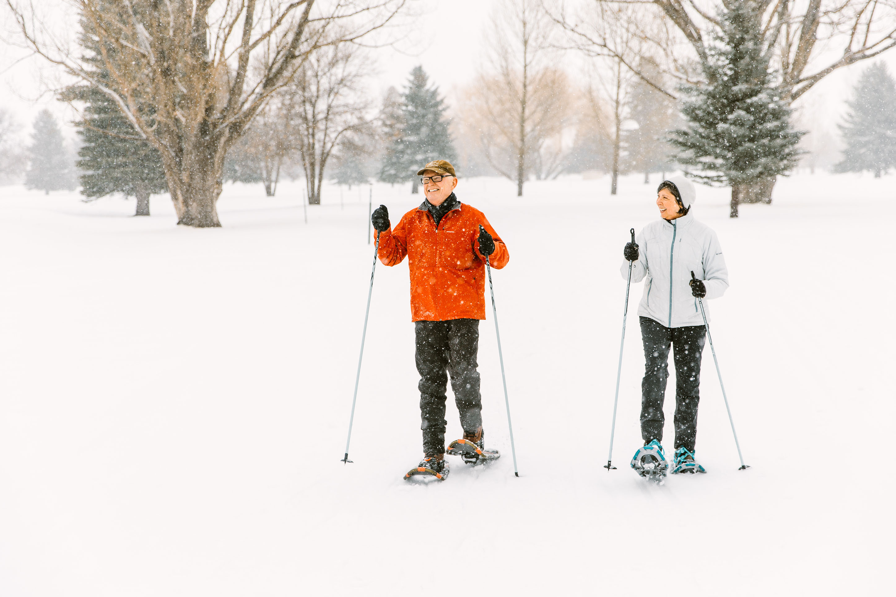 photo of an older couple on snowshoes 