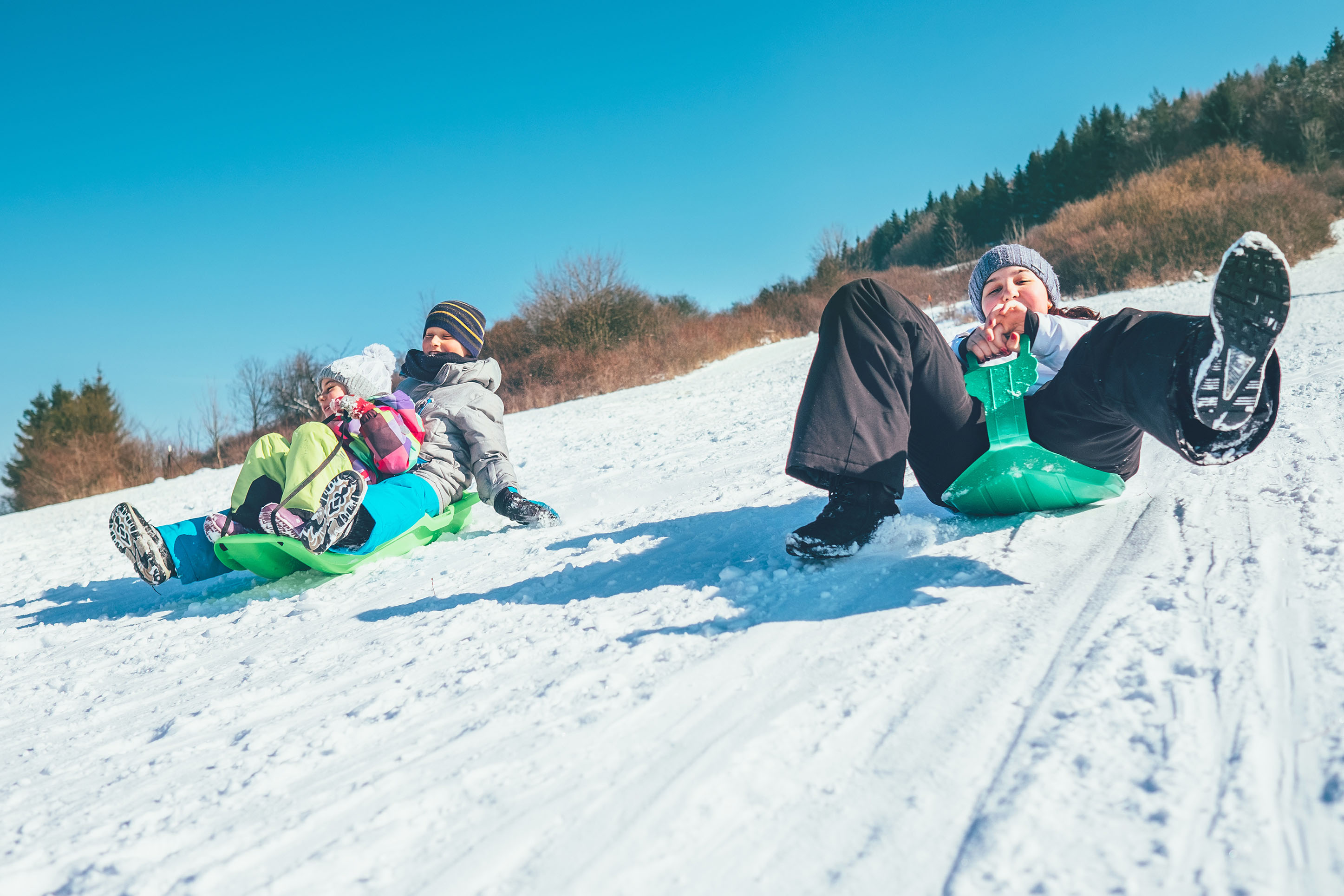 photo of kids sledding