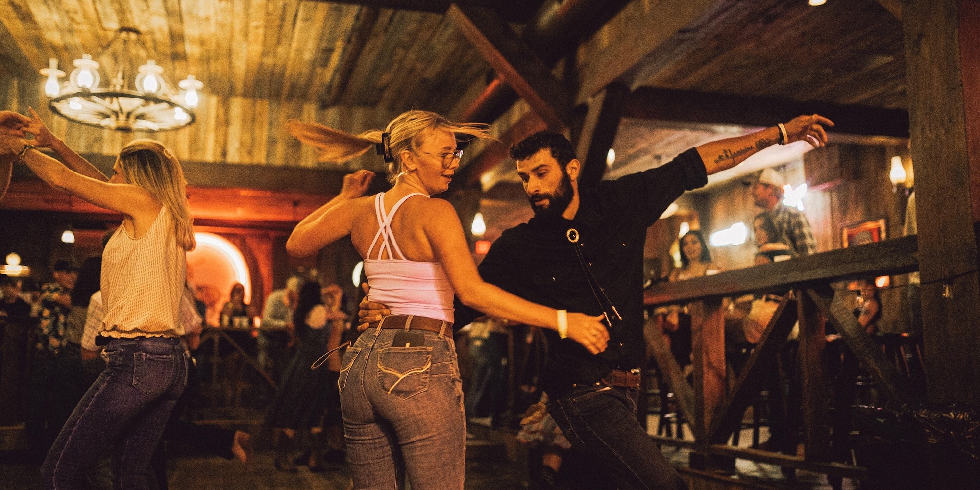 Couple country swing dancing at The Westerner in Bozeman, Montana.
