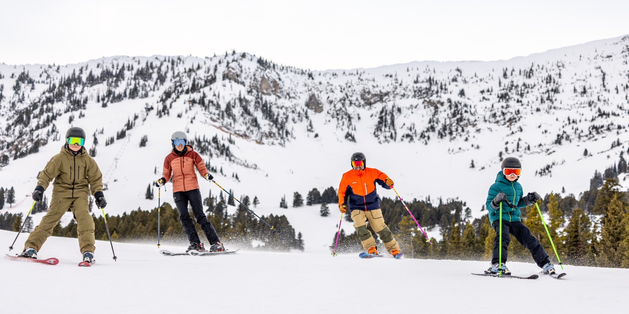 Family of four skiing at Bridger Bowl Ski Area.
