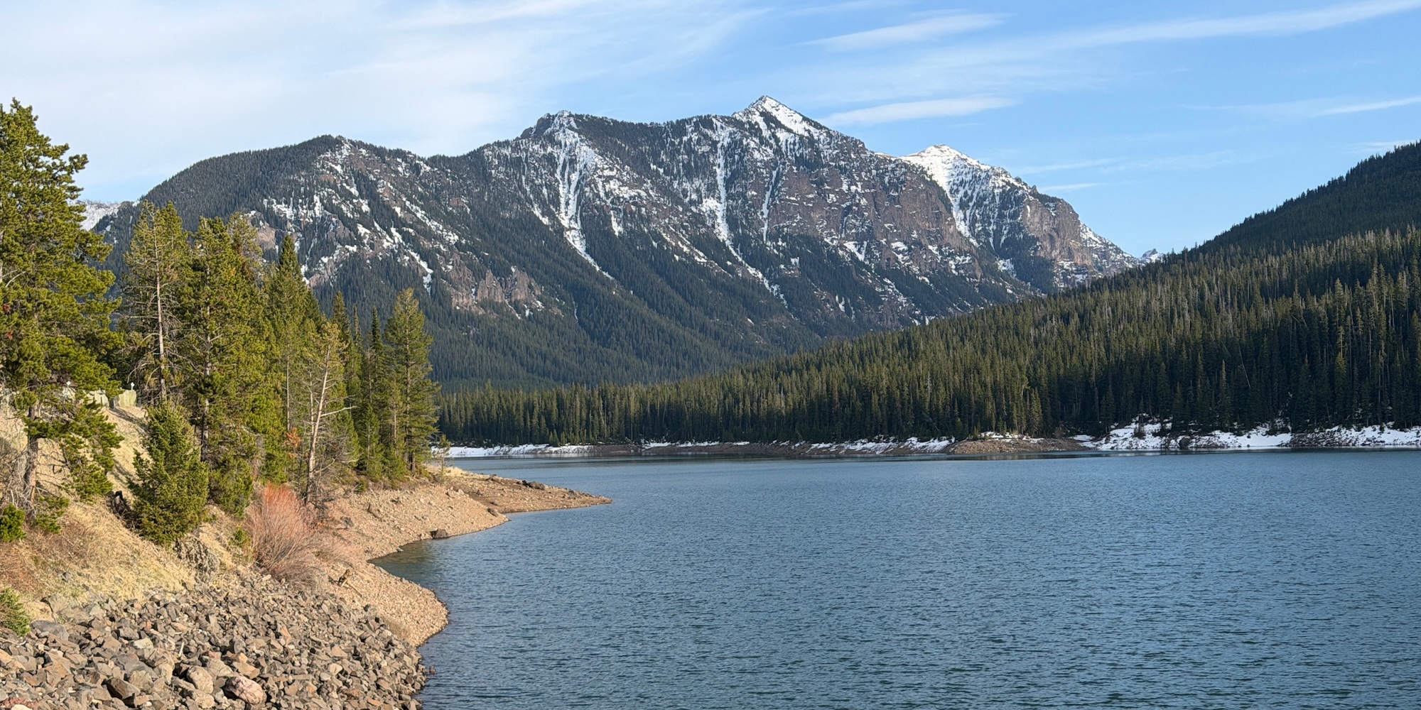 Hyalite Reservoir with snow-capped mountains in the background