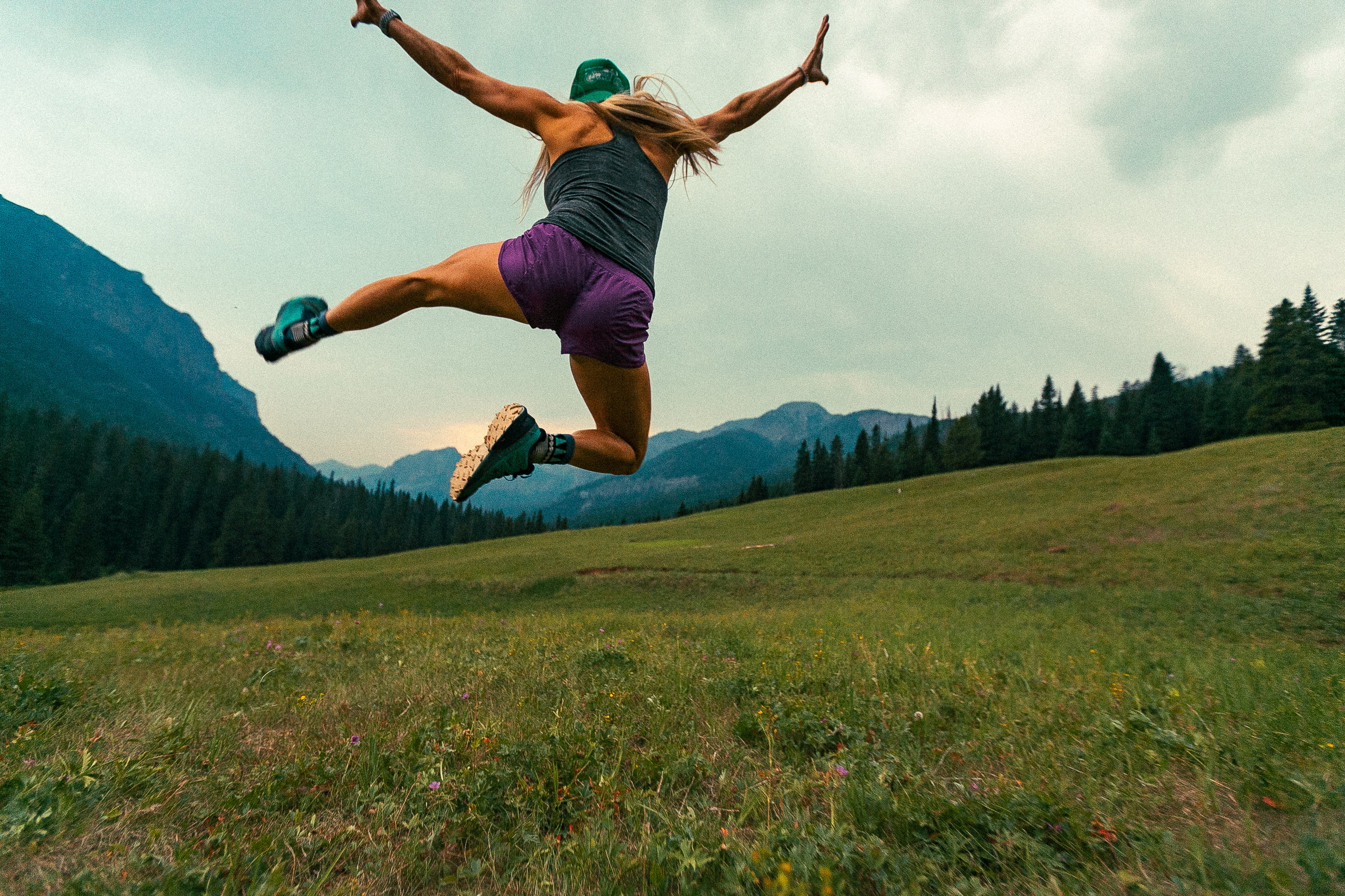 Runner jumping at Hyalite Canyon