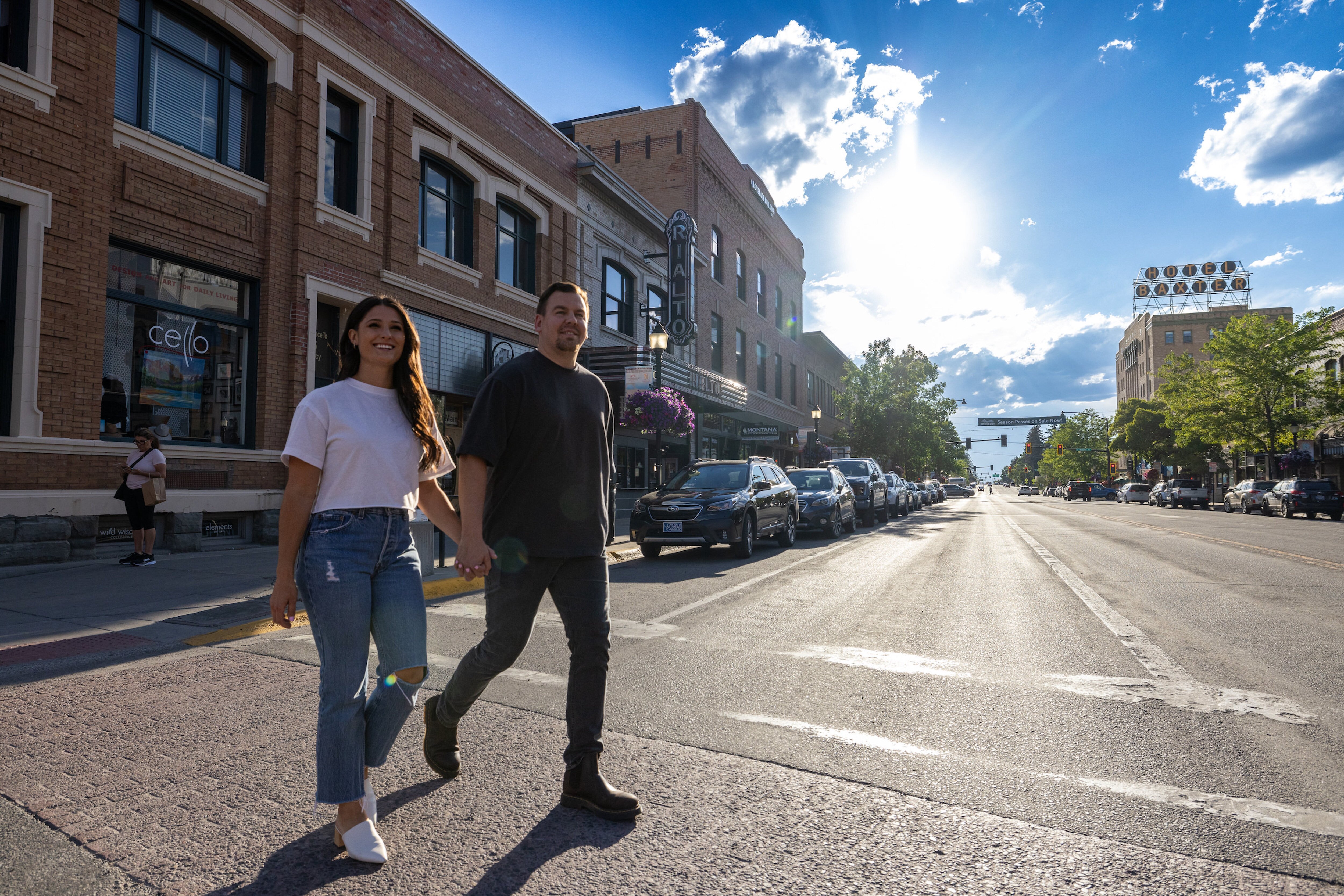 A couple walking and holding hands in Downtown Bozeman